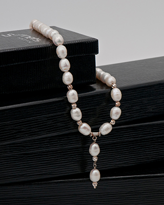pearl necklace on a jewelry box